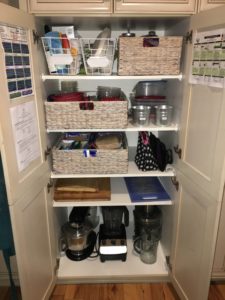 organizing a pantry with baskets